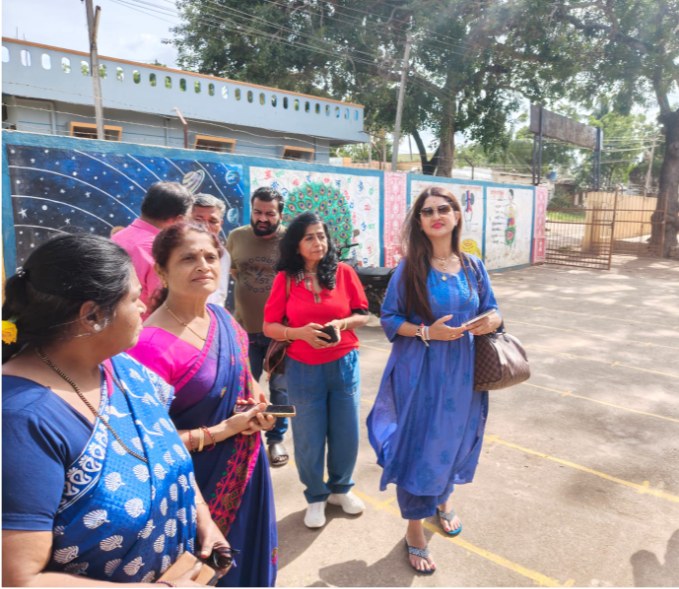 The Akshara Daana team with local supporters inspecting the school grounds