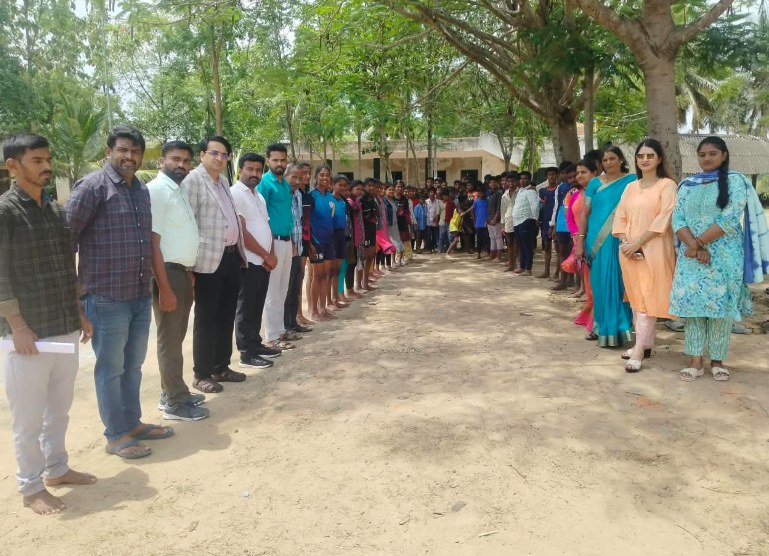 The Akshara Daana committee with students during the school visit